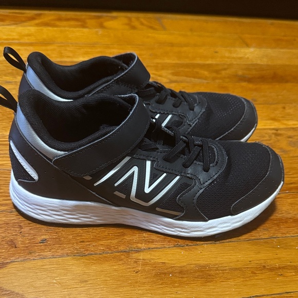 Gently worn boys New Balance Kids' Black and White Sneakers - Picture 2 of 5